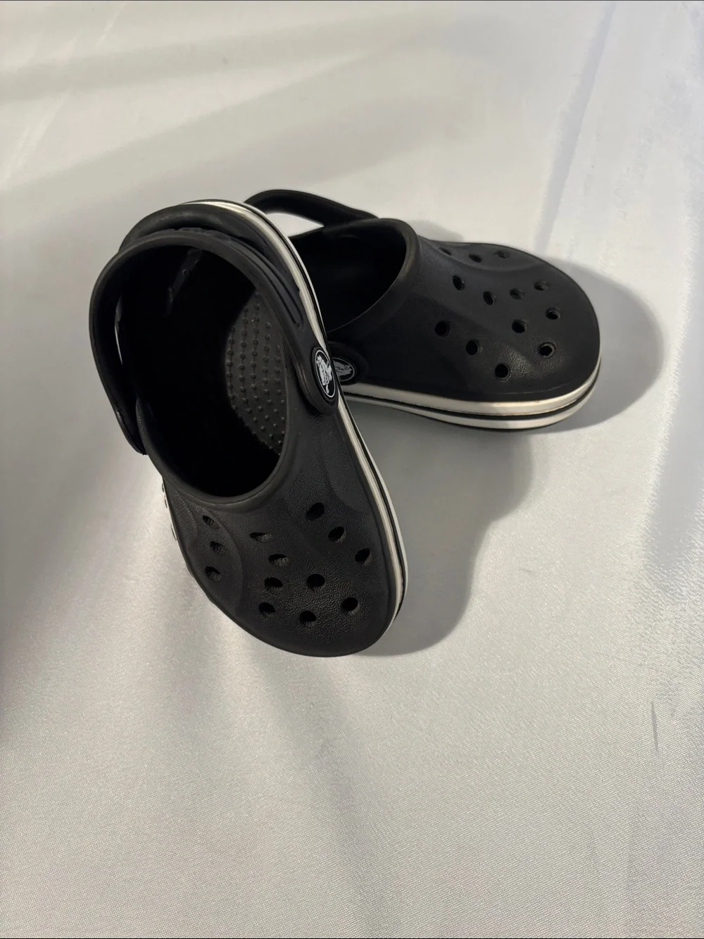 CROCS Kids Black Clogs with White Stripe